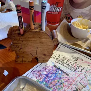 Kids menu with cute little wooden pig crayon holders