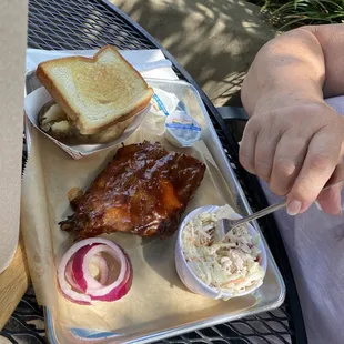 Ribs lunch bake potato and coleslaw