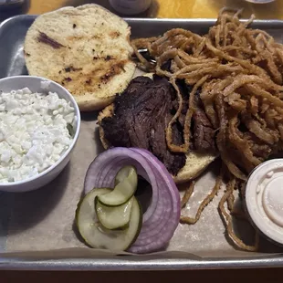 Brisket add bun with Cole Slaw and Side Onion Straws