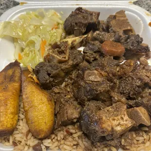 Ox tail, rice and peas, cabbage and plantain
