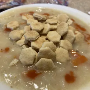 chicken lemon rice soup with oyster crackers and hot sauce