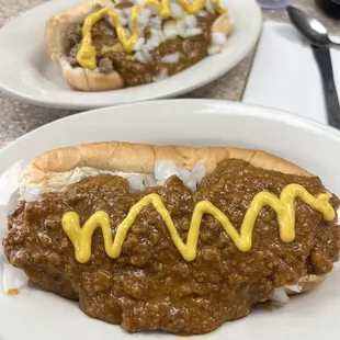 a chili dog with mustard