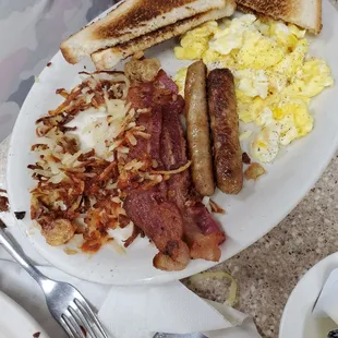 Breakfast scramble egg bacon and sausage with toast