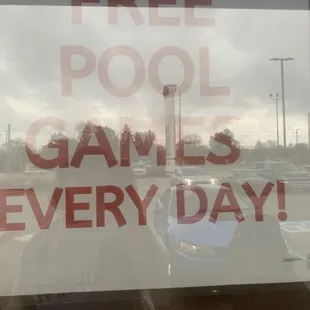 Sign that says "Free pool games everyday!"
