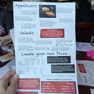 a person holding a menu
