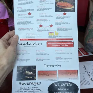 a person holding a menu
