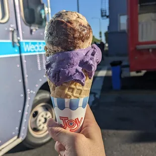 Kare almond fudge and ube ice cream in a waffle cone