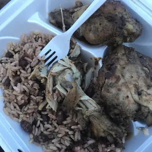 The jerk chicken plate with beans and rice.