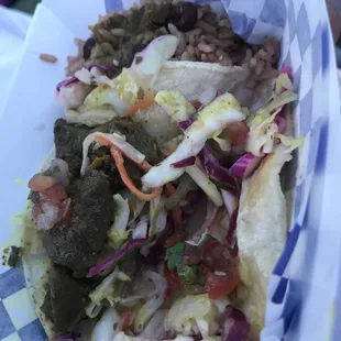 2 Tacos: curry goat and curry chicken