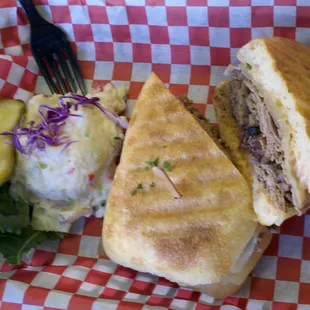 potato salad with roast beef sandwich