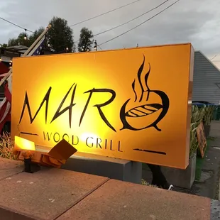 a sign for maro wood grill