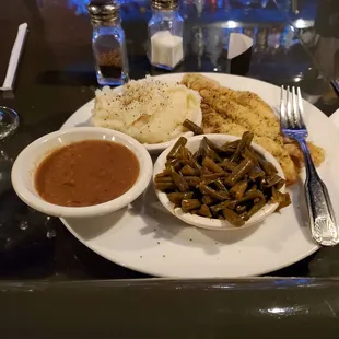 Fantastic, home style dinner of grilled fish, green beans, mashed potatoes and gravy