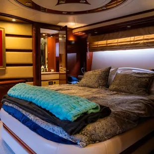 King size bed and entry to second head in the cabin.