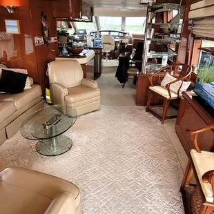 Main deck interior salon, galley and pilothouse.  The stairs to the cabin deck are forward and to the right.