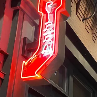 a neon sign for a restaurant