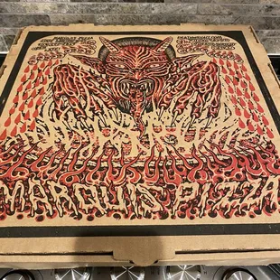 a pizza box with a drawing on it