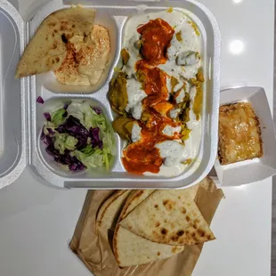 Chicken tanjiya combo: chicken tanjiya, basmati rice, salad, hummus, pita bread, and (freshly made) baklava. All for $8!!!