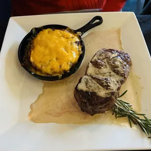 Strip steak with Gorgonzola sauce and potatoes.