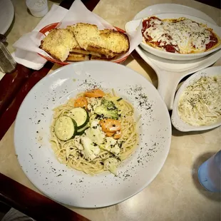 Pasta primavera in white wine sauce, garlic bread, and Tour of Italy (ravioli in marinara, linguini w/alfredo)