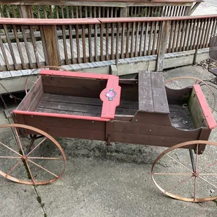 an old wooden wagon with wheels