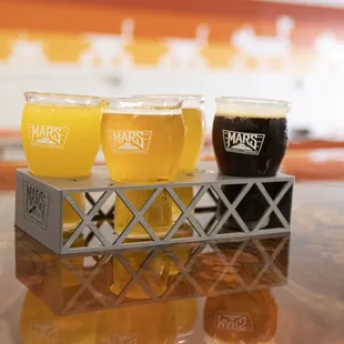 a row of beer glasses on a table