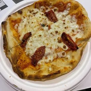 $14 "Mediterranean Pizza".  A slice of pita with 4 tiny bits of tomato ?