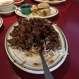 Sesame beef with pot stickers