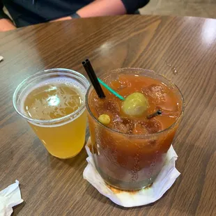 a bloody drink and a glass of beer