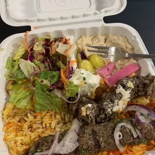 a meal in a styrofoam container