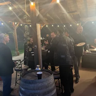 Large covered patio with fire tables and seating