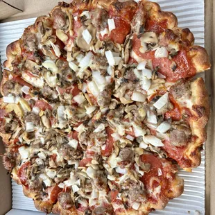 Large pepperoni, sausage, mushroom &amp; onion. $20.00 and well worth it!  That pinched crust is really the "icing on the cake".
