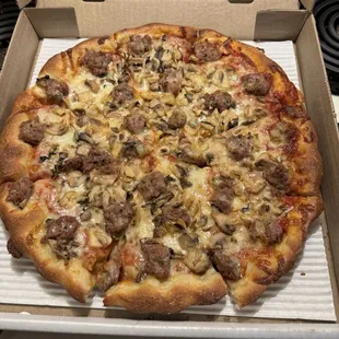 Large sausage and mushroom pizza