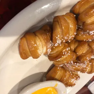 Tasty pretzel bite appetizer with cheese sauce.