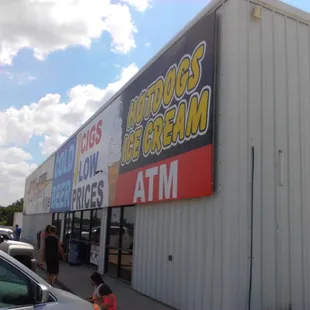 storefront with children walking by