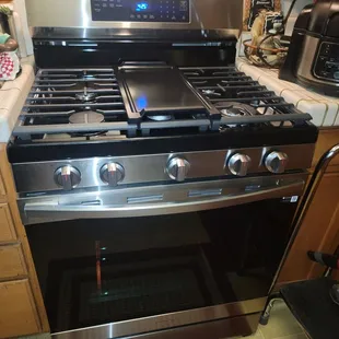 The oven range that was installed and how clean and neat his work area was left.