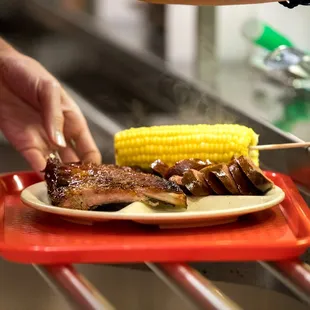 ows a plate of food being prepared