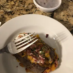 The $10 loaded baked potato. Greasy and tiny.