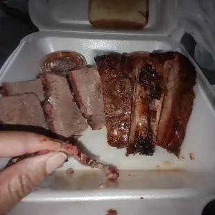 2 meat combo - Brisket is thinner than paper and looks like 1 slice cut into 5 pcs. Ribs are 1full rib cut in half with one small piece.
