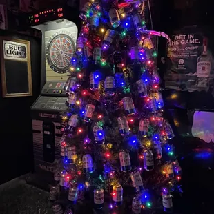 a christmas tree made out of beer bottles