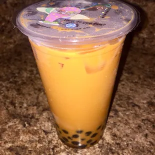 a plastic cup with bubble tea