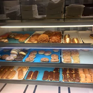 a display case filled with donuts