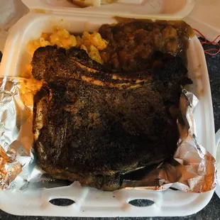 Steak, Mac n cheese, yams, macaroni salad, 2 slices of white bread.