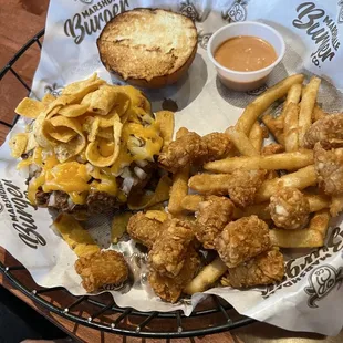 Hamburger, bison chili, Fritos, sauce.  Fries, tators, onion rings so good!