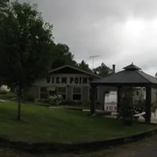 the front of a house with a car parked in front of it