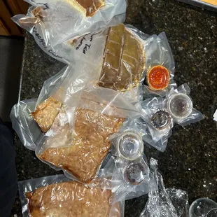 a variety of food wrapped in plastic