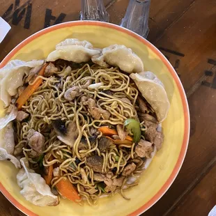 a bowl of noodles with meat and vegetables