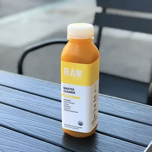 a bottle of juice on a table