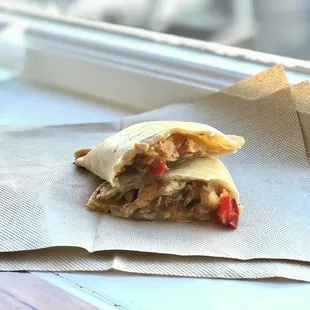 a burrito on a napkin