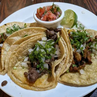 Chorizo, steak and pastor tacos