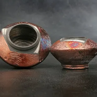 Product shot: small raku pots by Joni Pevarnik.
